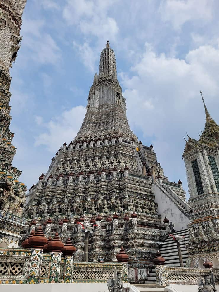 Wat Arun in Bangkok is decorated with tiny coloured porcelain tiles, painted in detailed patterns. 