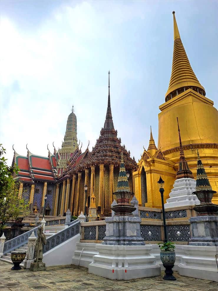  The Phra Siratana Golden Chedi sits next to the Phra Mondop buddhist library, and Wat Phra Kaew can just be seen in the background at Bangkok's Grand Palace