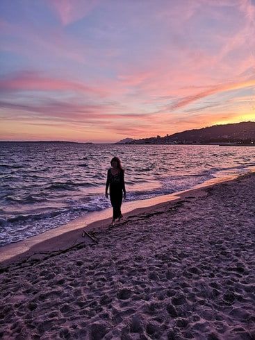 Walking along Juan les Pins beach at sunset in the French Riviera 