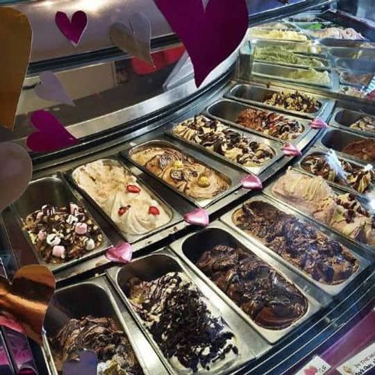 A counter full of different gelato flavours at In the Pink Gelato shop in Byron Bay