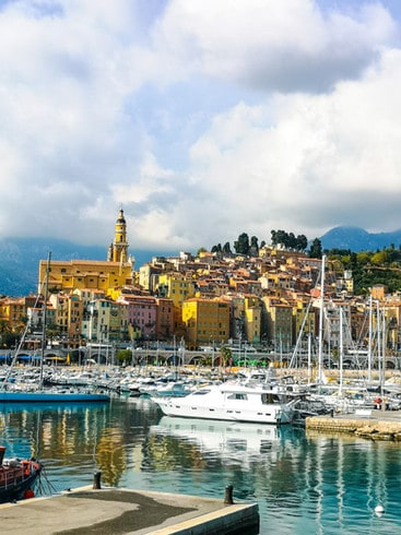 The Port of Menton is surrounded by the colourful buildings of Menton Old Town