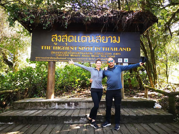 A sign points out the highest point in Thailand at Doi Inthanon Peak but it is surrounded by trees, meaning no views!