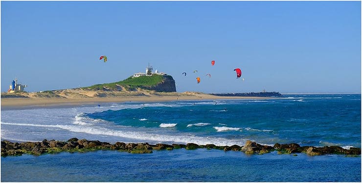 Windsurfers at Newcastle's famous Nobbys beach in New South Wales, Australia