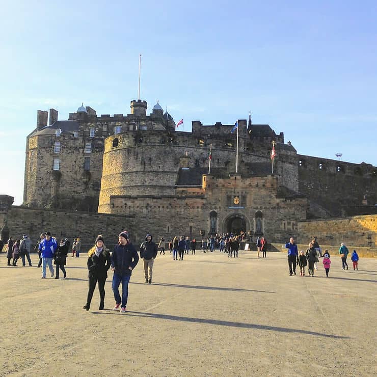 A long, wide entrance leads to the imposing stone building of Edinburgh Castle