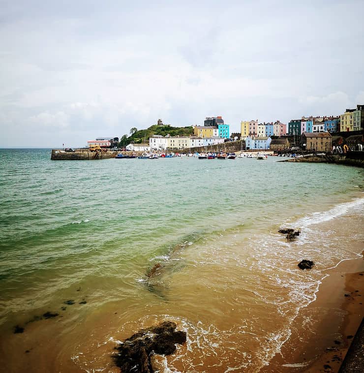 Tenby harbour and Castle hill from Tenby's North beach 