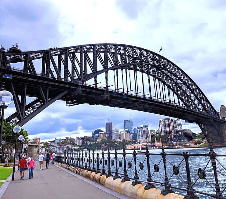 Standing under the Sydney Harbour Bridge at Hickson Road Reserve in Sydney, Australia