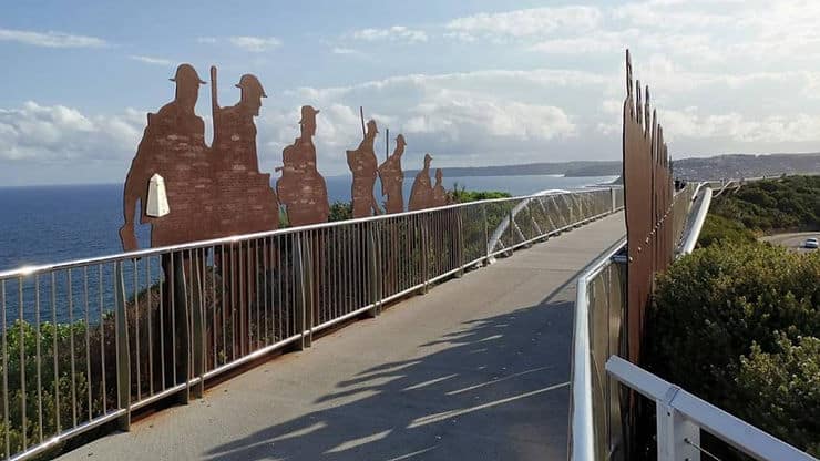 Silhouettes of soldiers on the Newcastle Memorial bridge walkway to commemorate soldiers who lost their lives in the war, Newcastle, New South Wales, Australia 