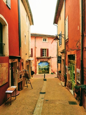 The Pinky-Orange buildings and narrow streets of Roussillion village