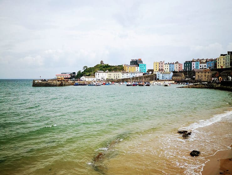 Rows of colourful houses overlook Tenby's coastline and harbour