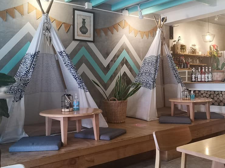 Inside the Tent cafe in Phuket Town, you can sit on cushions, under small tepee-style fabric tents.