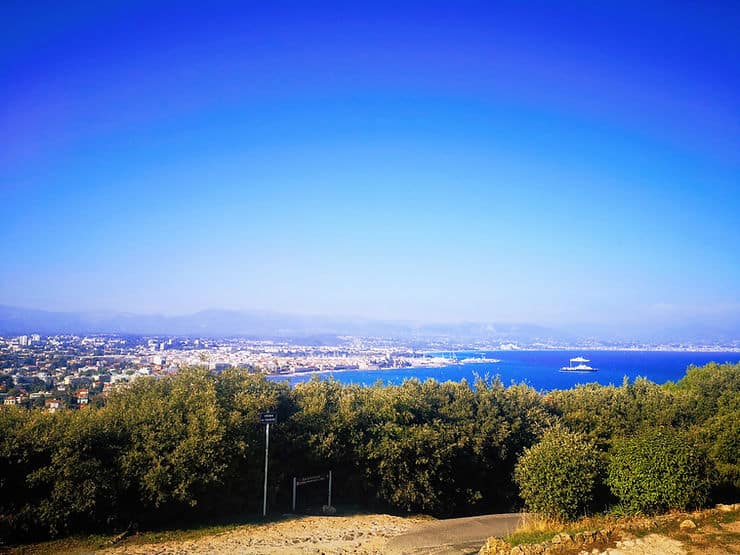 Standing at La Garoupe viewpoint on Cap d'Antibes with stunning views across Antibes