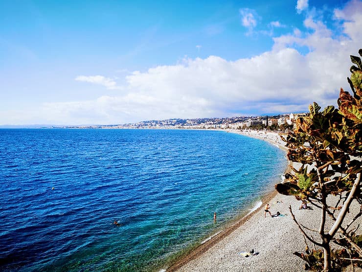 The narrow, long pebble beach of Nice