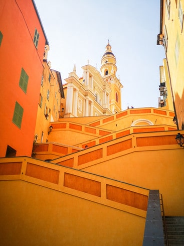 Colourful stairs lead to the baroque church of St Michael in Menton 