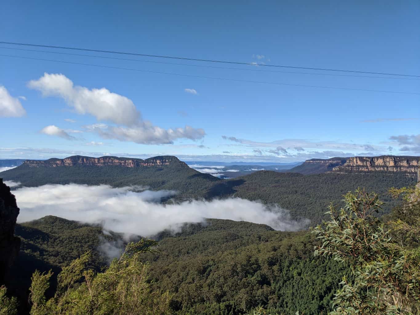 Standing above the clouds looking across the Blue Mountains range in New South Wales, Australia