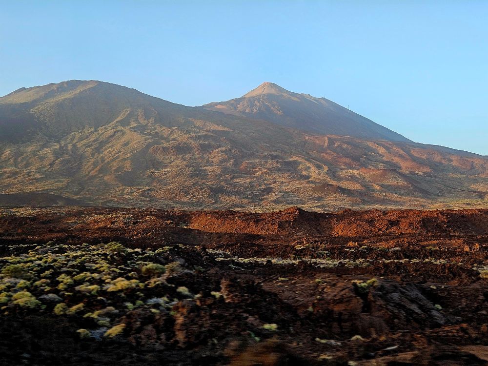 the Peak of Mount Teide in Tenerife rises from the volcanic landscape
