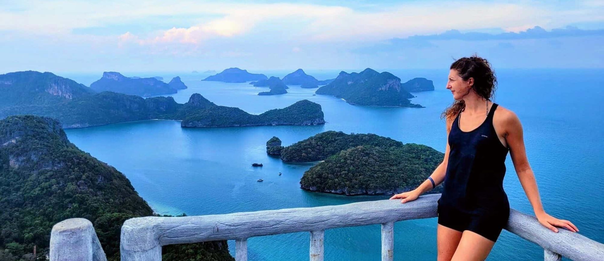 Girls standing overlooking tropical islands.